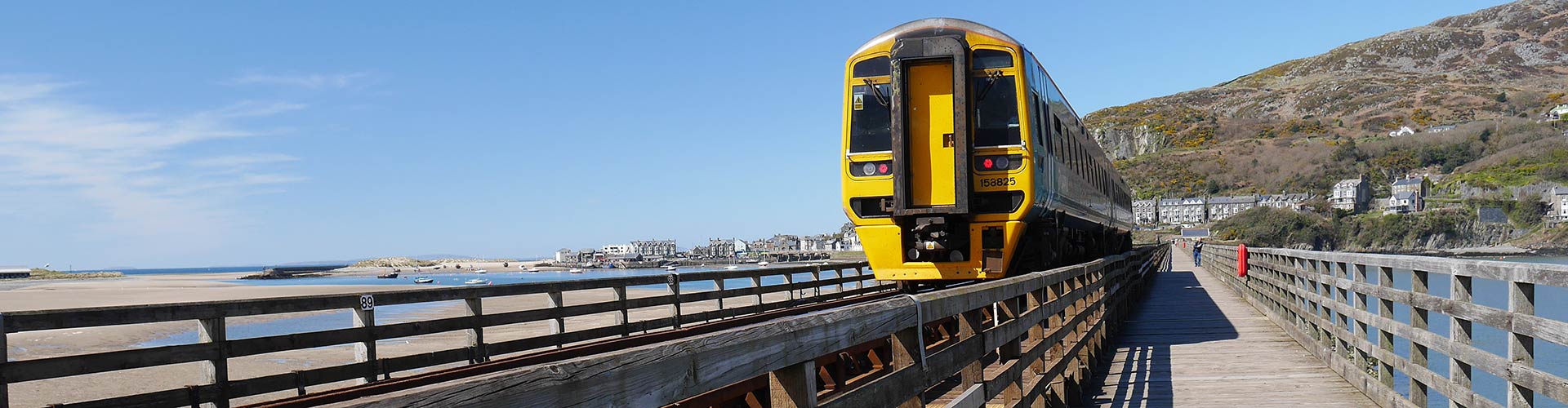 Train crossing the estuary at Barmouth on the Wales Coast Path Train crossing the estuary at Barmouth on the Wales Coast Path